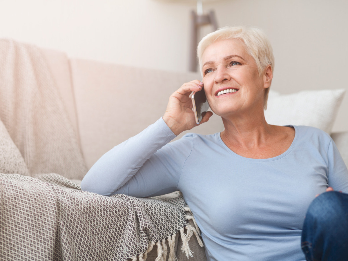 Woman on mobile phone on floor